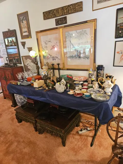 Researched and priced china, teapots and art, staged for sale