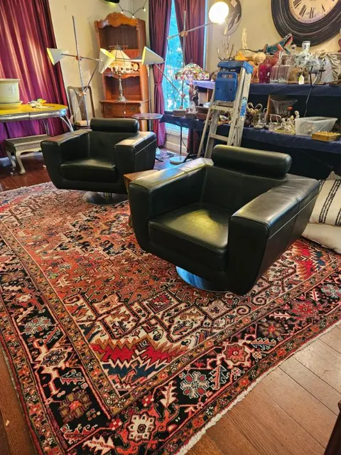 Mid-century leather chairs on a Persian rug